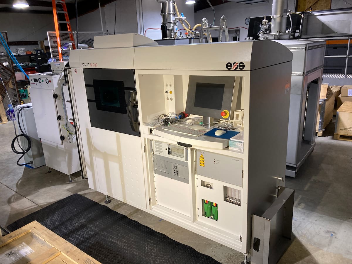 EOS EOSINT M280 LPBF printer with access doors open during service at Laser Fusion Solutions